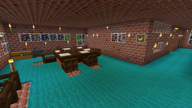 A cozy brick room with cyan carpet on the floor. There is a dark oak table with chairs around it in the center.